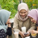Asian group hijab woman smilling in cafe with friend